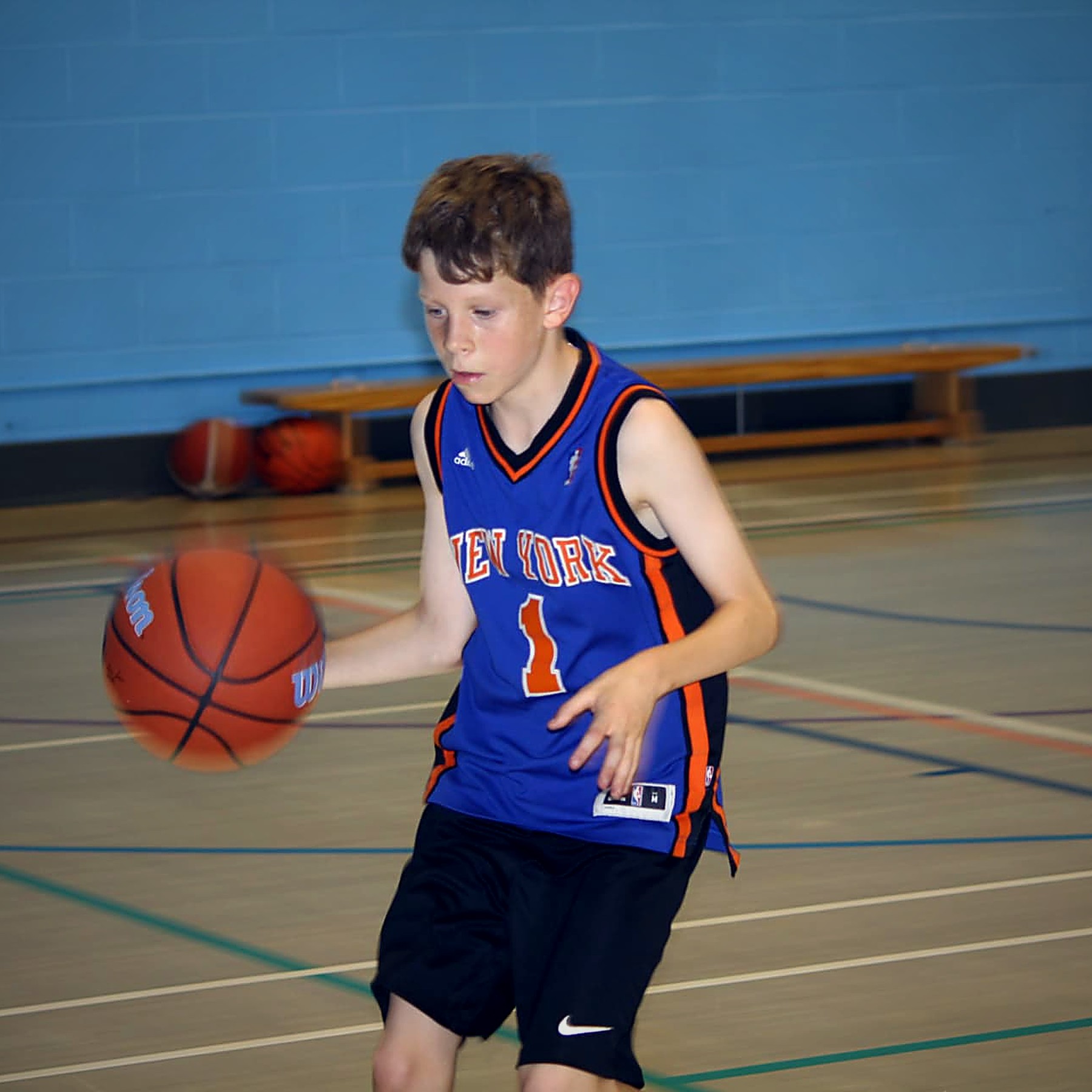 A young player working on ball handling during a PHB coaching session