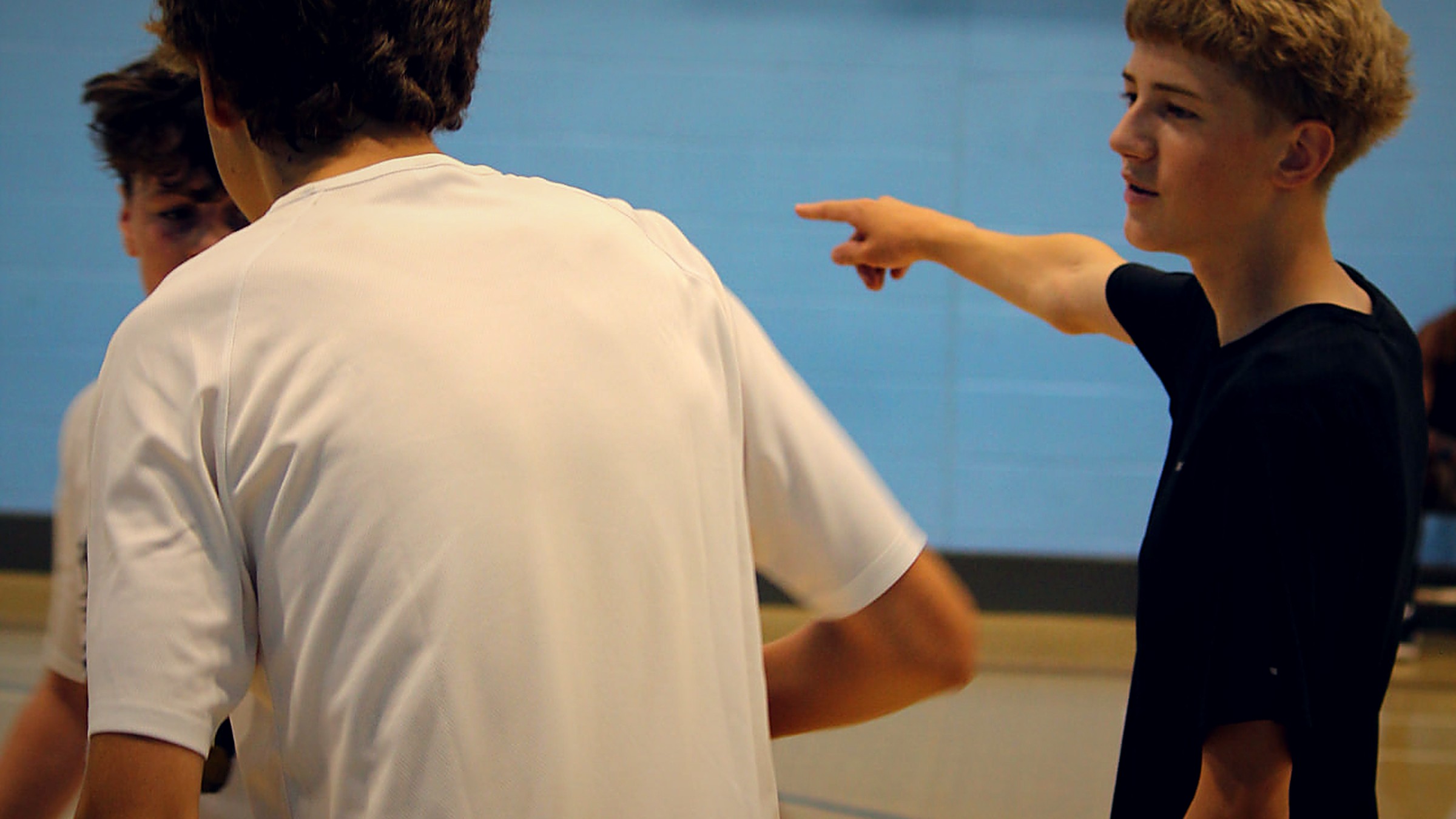 Young participants communicating and working together during a Pro Hoops Blueprint session